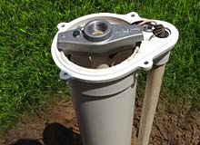 Photograph of well pump head exposed for repair or service